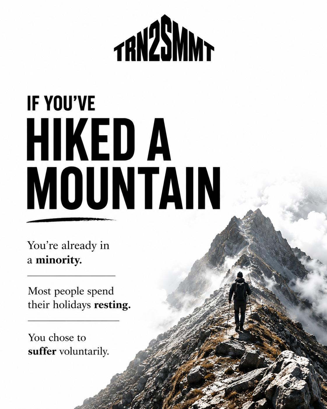 Lone hiker walking along a rocky mountain ridge beneath the TRN2SMMT logo